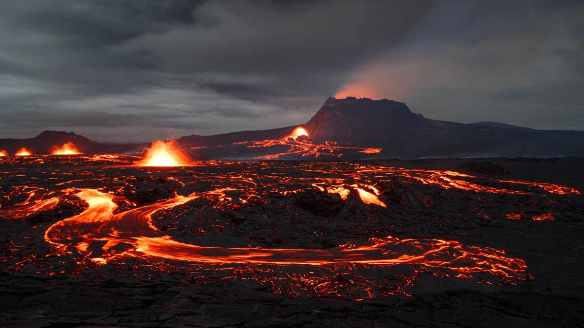 Aerial view of illuminated mountain against sky at night lava volcano