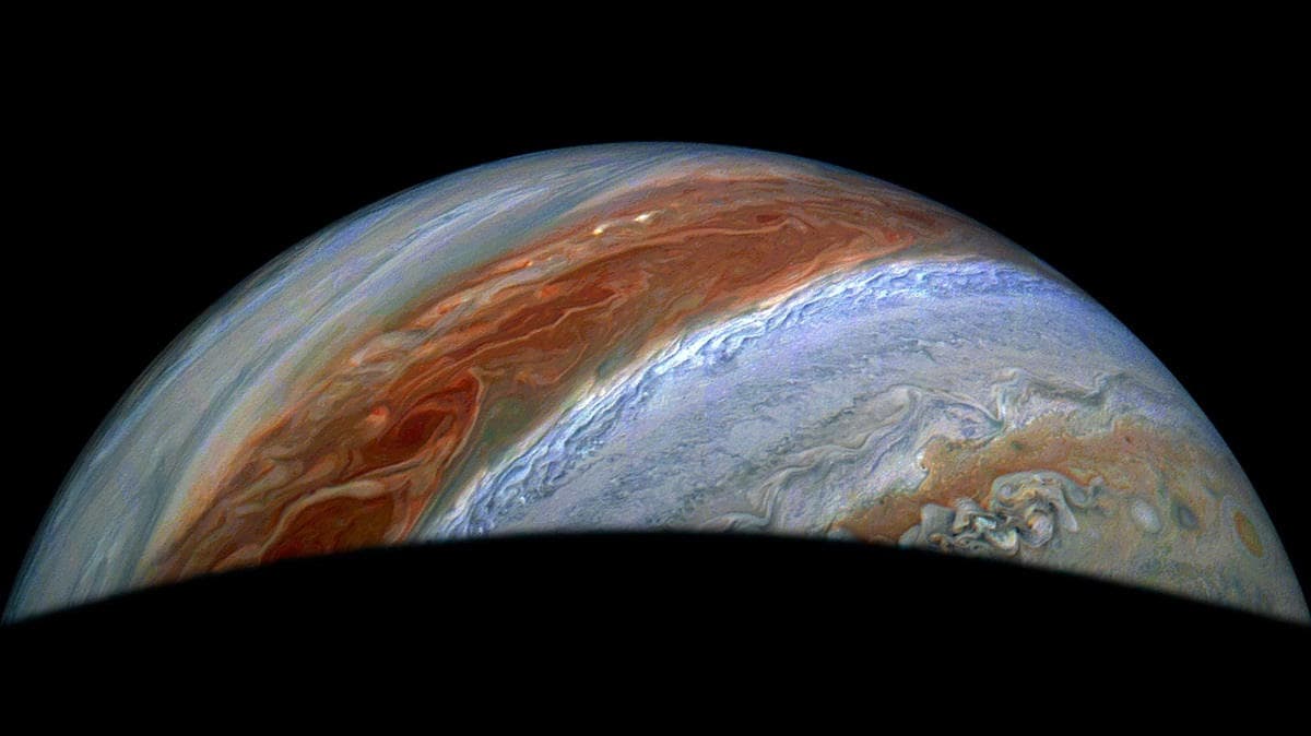 Jupiter seen over moon silhouette