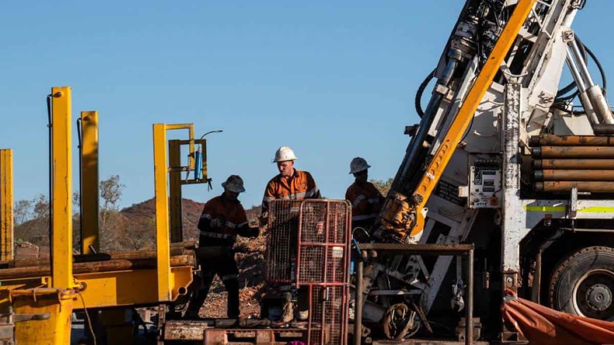 Mining workers and machinery in outback australia