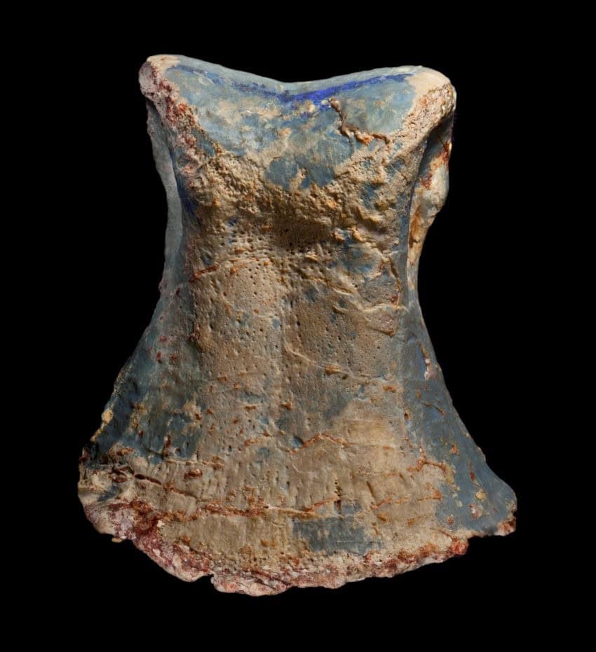 An opalised bone shaped like a cylinder but narrow at the top and wider at the base.