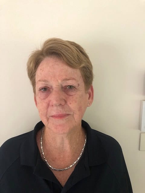 Headshot of a woman wearing a black shirt and silver necklace.
