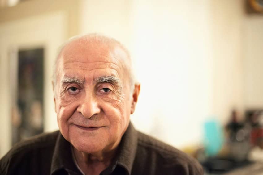 An ageing elderly man stares at the camera