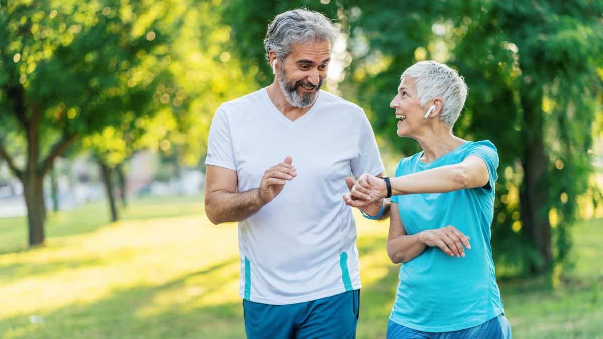 Senior couple using sports technologies