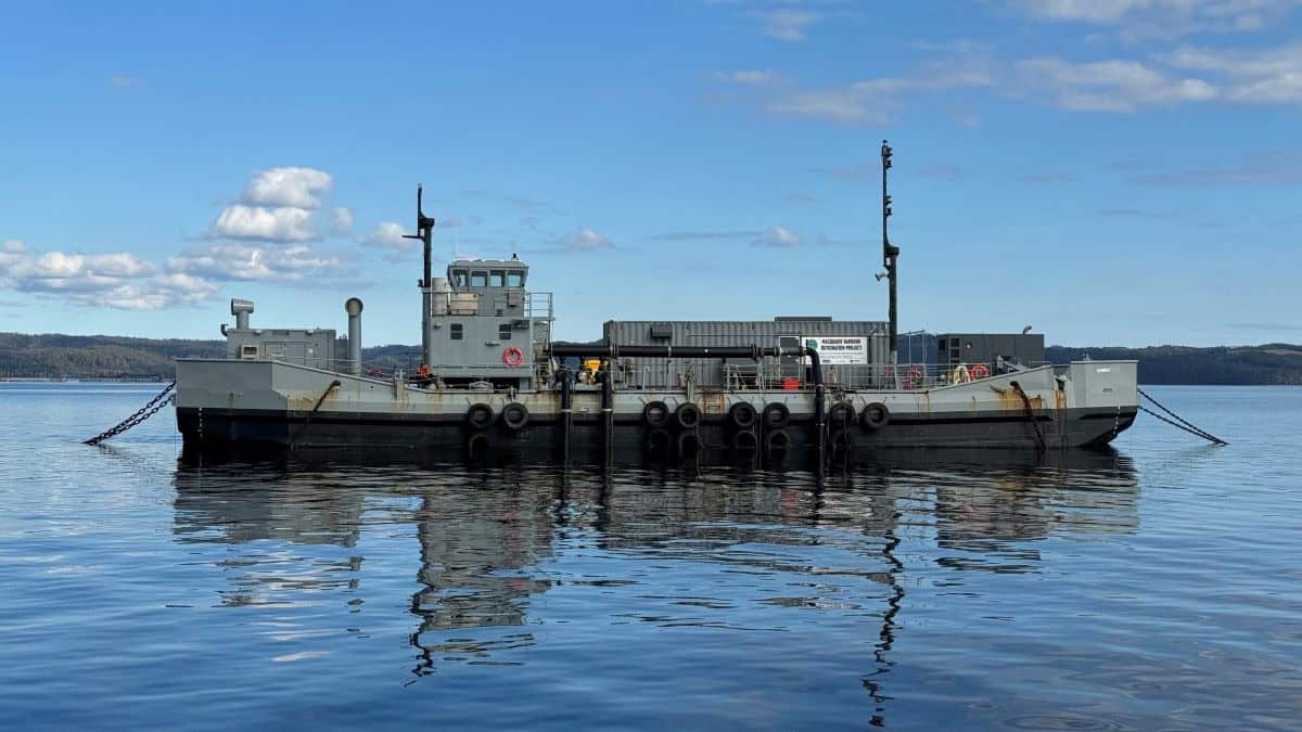 Barge anchored in still water.