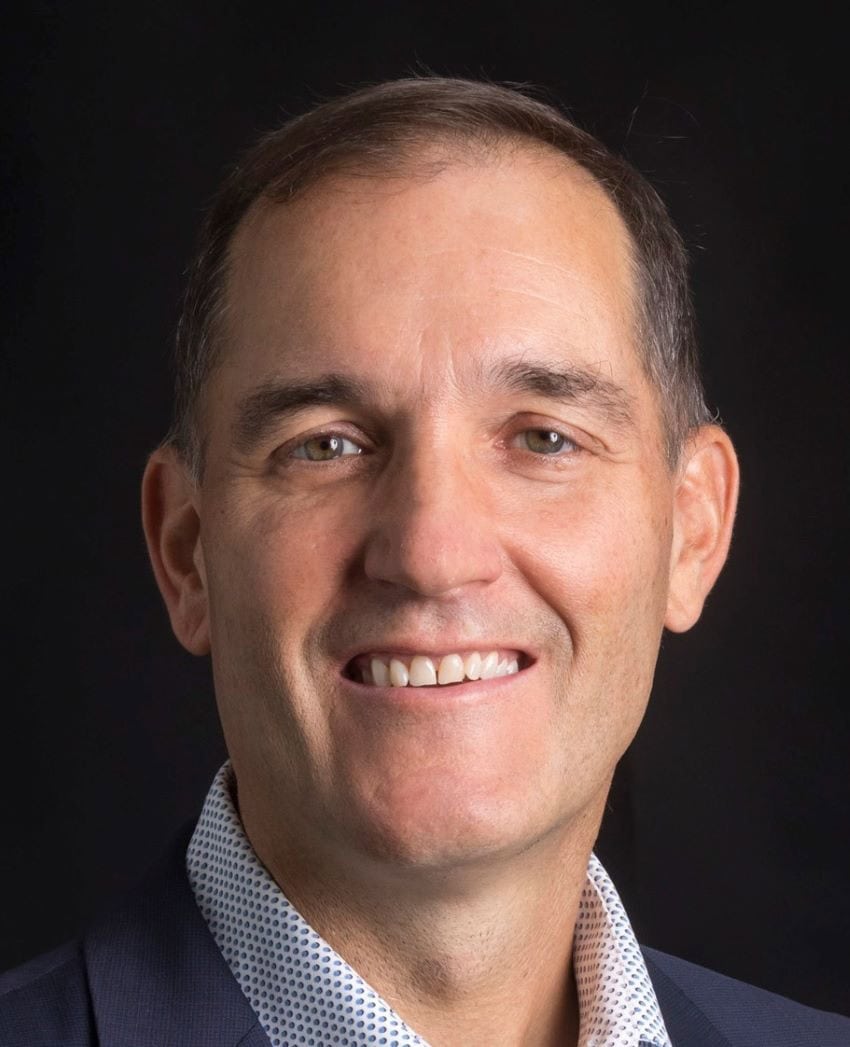Headshot of ross dawson, male, short brown hair.