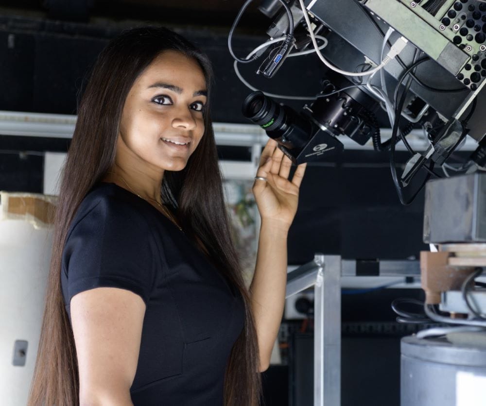Woman scientist with telescope