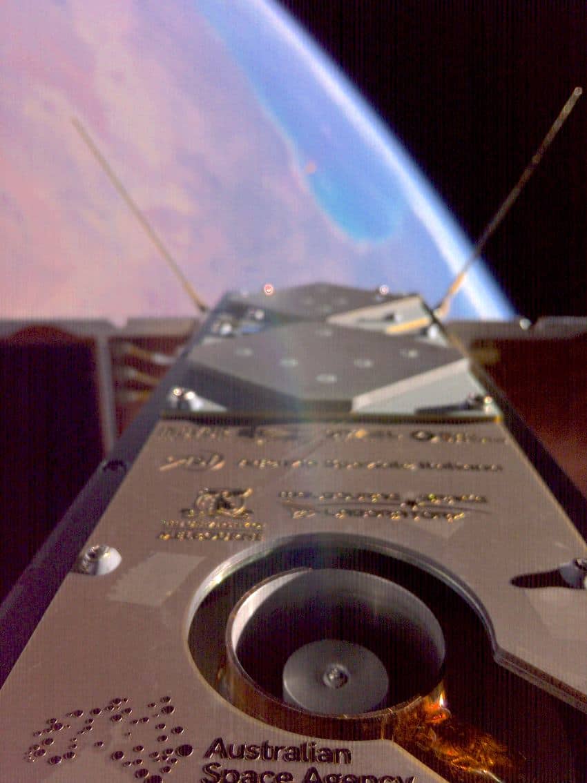 A selfie photograph of a satellite showing its perspective looking down on earth