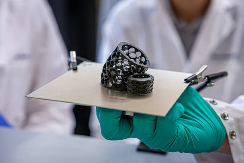 Dark grey material formed into a cylindrical shape