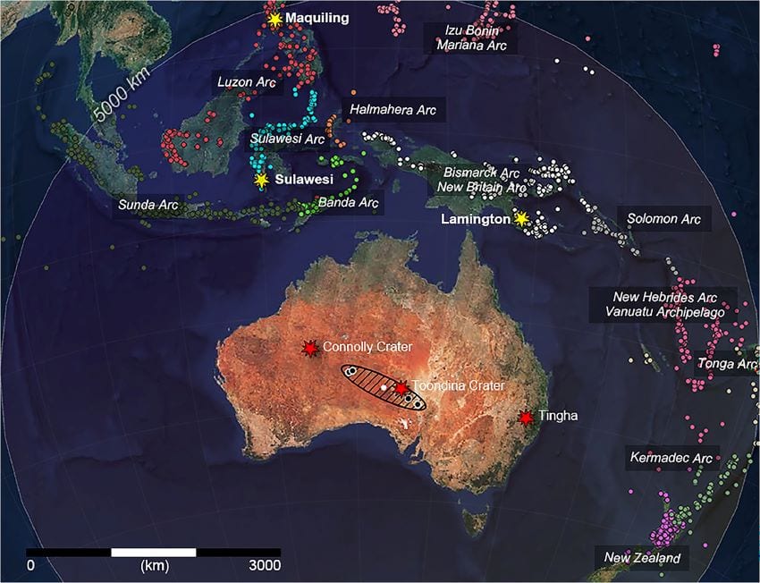 A map showing australia and surrounding pacific islands. An ellipsoid is stretched across northern south australia, indicating the new ananguite strewn field. Volcanic arcs throughout the pacific are represented by coloured points
