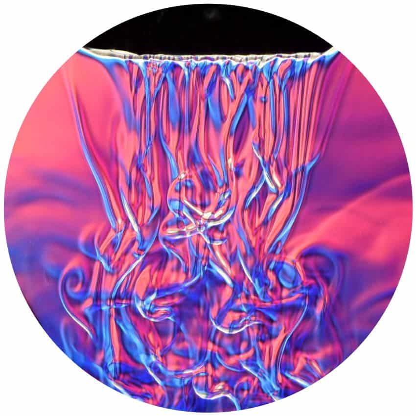 An image of water flowing downwards shown in pinks, purples, and blue to represent the different temperatures and densities of the liquid