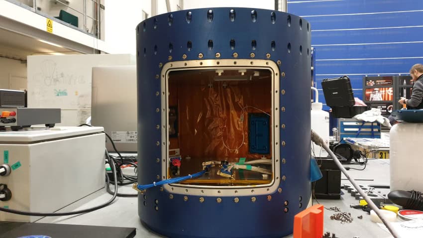 A section of a rocket where experimental payloads, like bacteria, could be stored during its flight