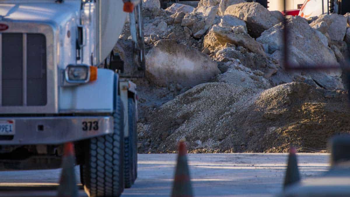 close up of cement plant with truck in foreground