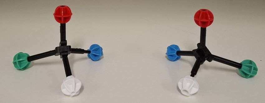 Two molecular models, one the mirror image of the other