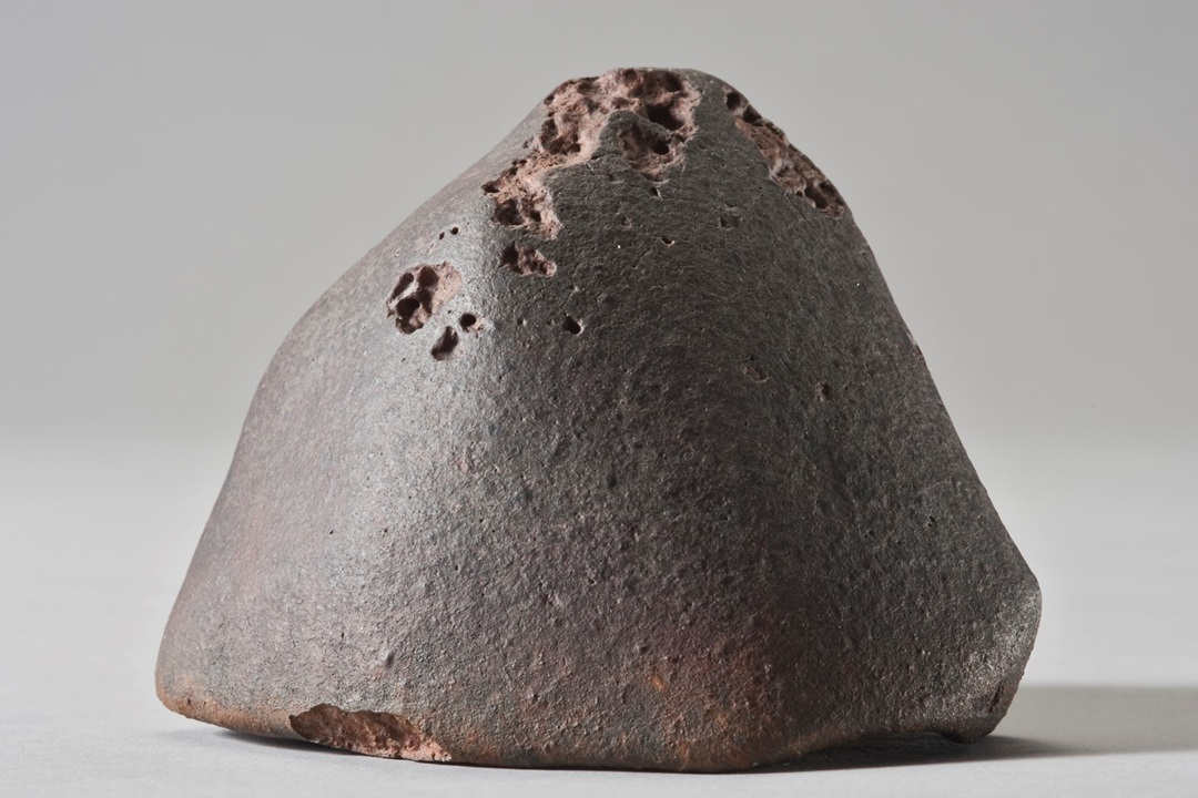 Meteorite on grey background