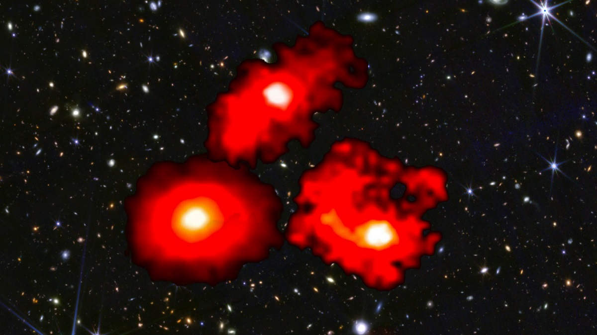 Three bright red galaxies in space