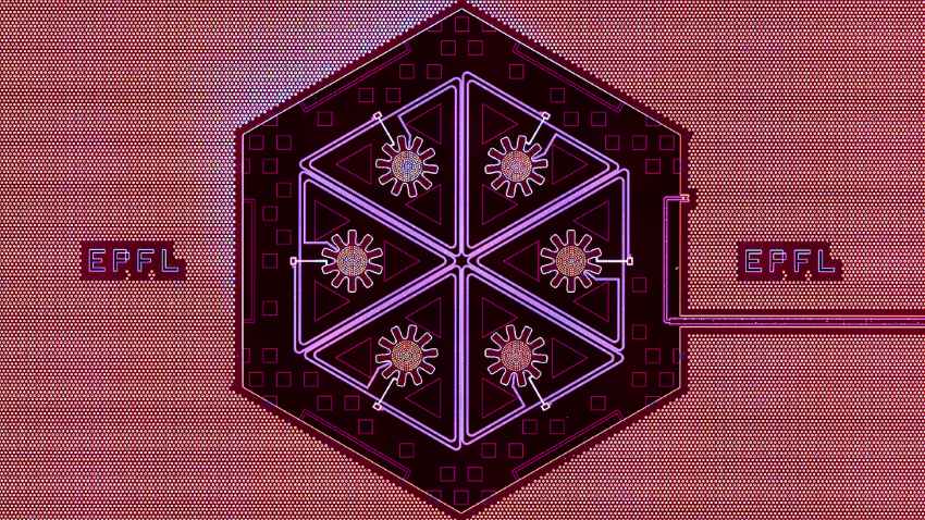 A photograph of a miniature hexagonal structure that looks like a circuit board.