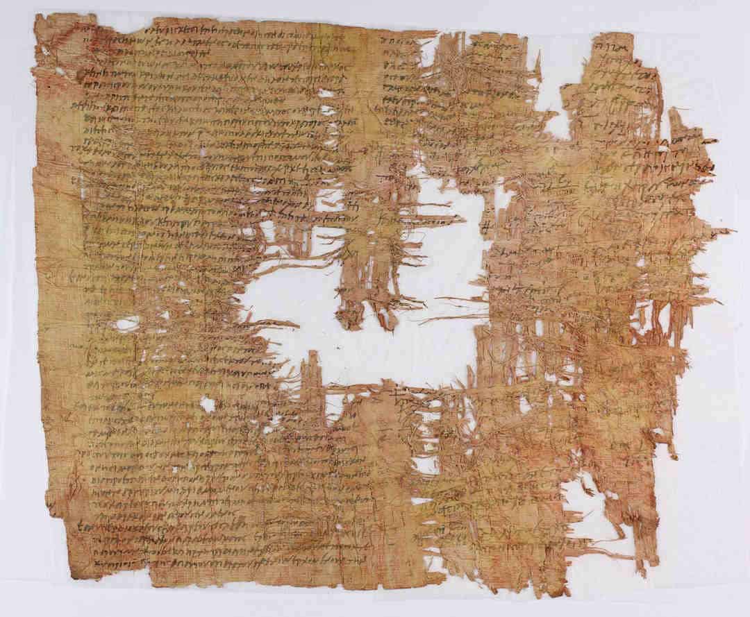 Torn ancient papyrus with greek writing