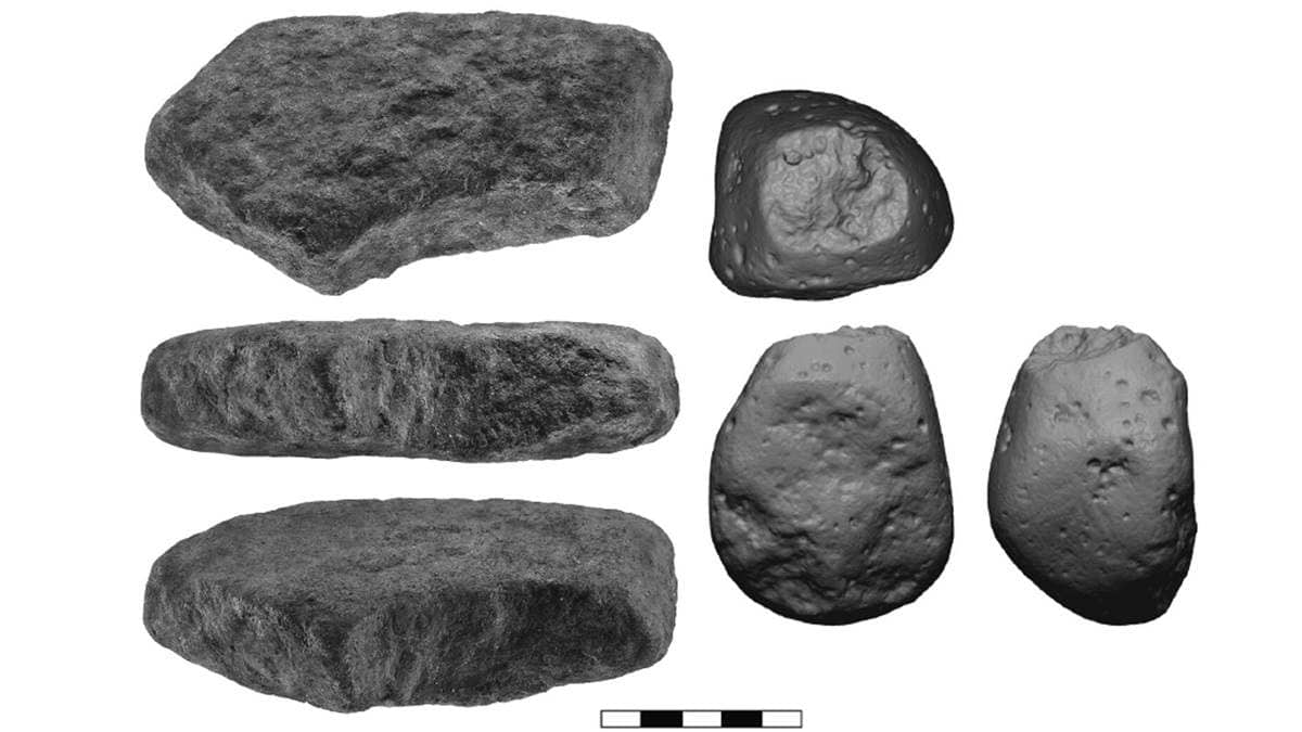 Stone tools found at archaeological site in greyscale on white background