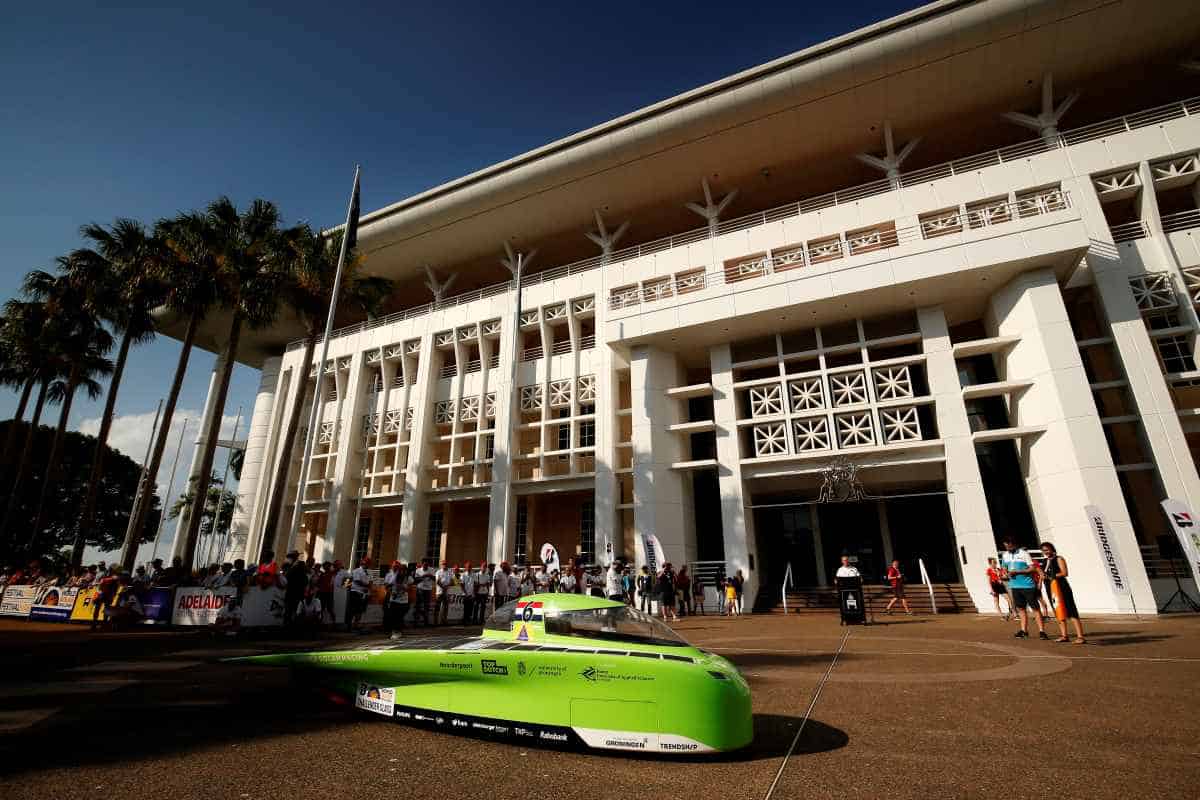 City heat: 'Green Lightning' from the Dutch World Solar Race team on the start line alongside the palm trees of Darwin's Parliament House. (Photo by Darrian Traynor/Getty Images for SATC)