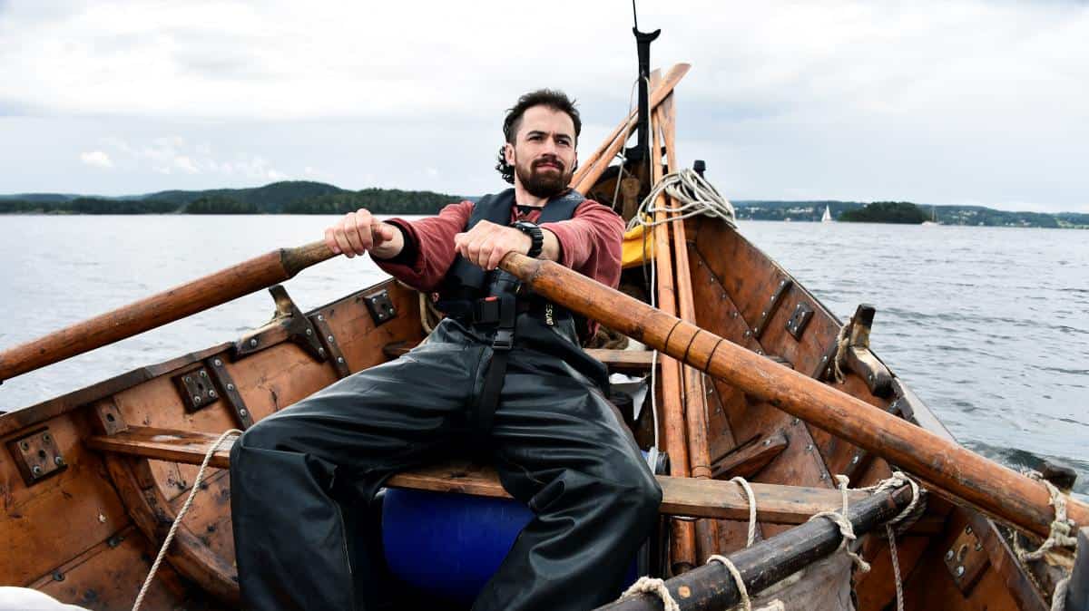 Man sailing viking boat replica