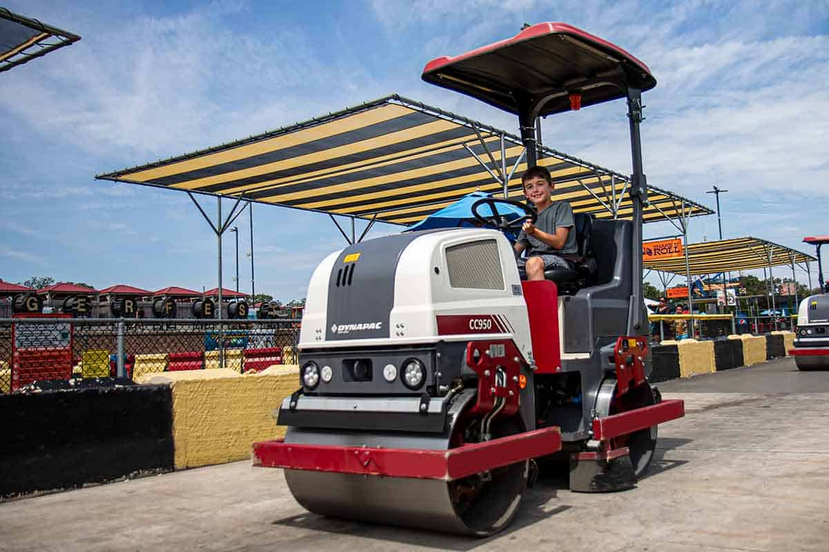 Boy drives roller around a special course.