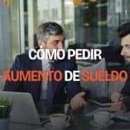 Hombre en una reunión con su jefe, aplicando una estrategia sobre cómo pedir un aumento de sueldo de forma profesional.