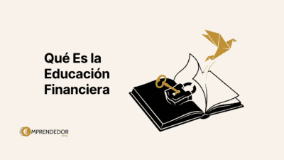 Qué es la educación financiera: libro abierto con llave dorada y pájaro origami como símbolo de liberación económica