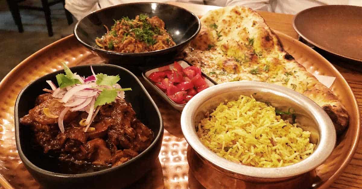 Ghee roast chicken and lamb and tomato bredie at Thali in Cape Town