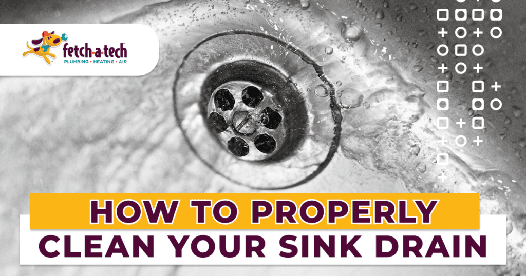 A close-up of a metal sink drain with fresh water running, featuring the text “How to Properly Clean Your Sink Drain” and the Fetch‑A‑Tech Plumbing Heating Air logo. This helpful image highlights our commitment to keeping Las Vegas families comfortable with friendly, trustworthy service you can count on.