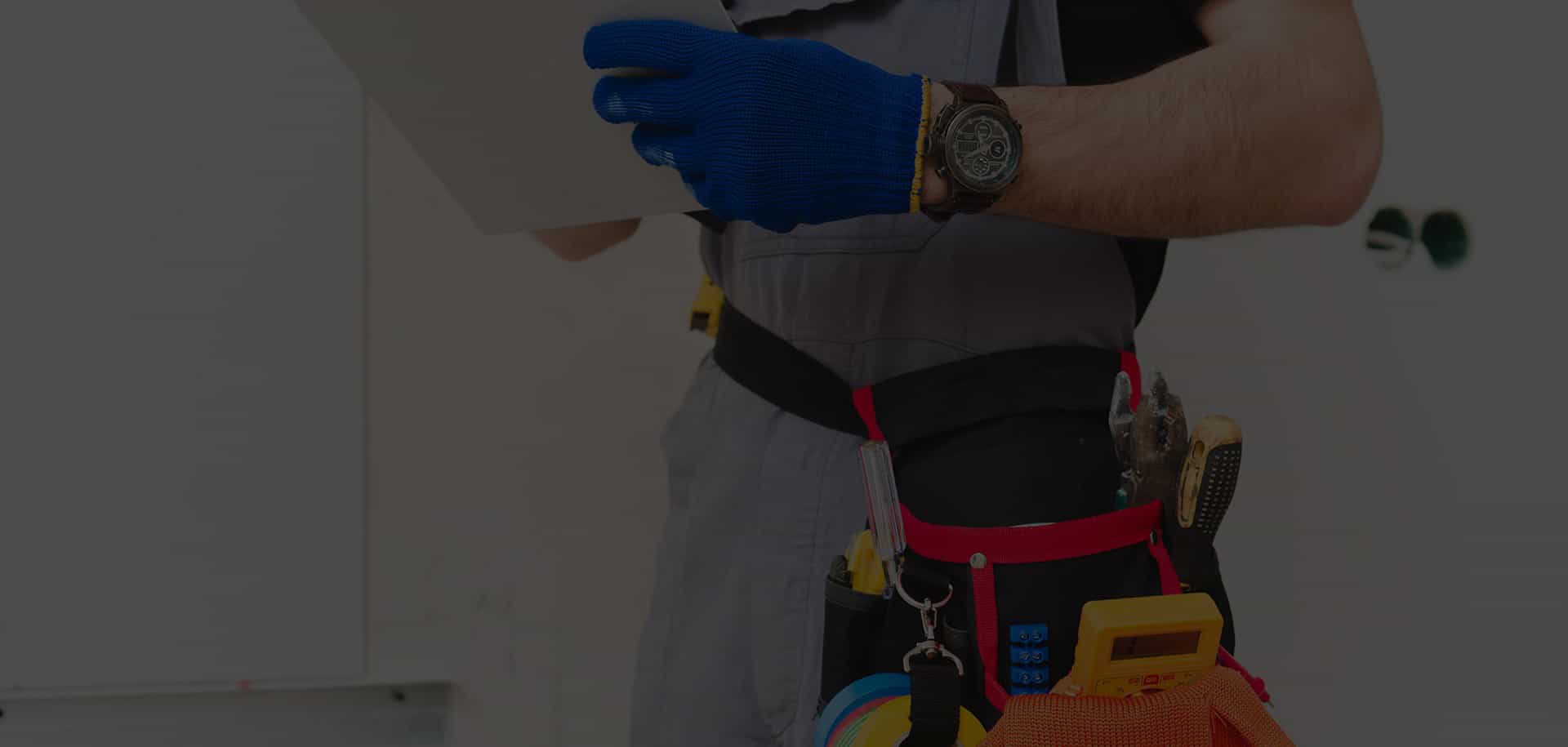 A man with a tool belt on