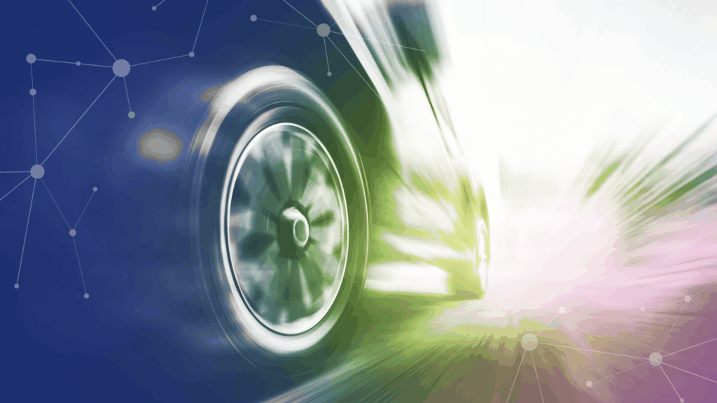A close-up of a car tire in motion, showing a vehicle speeding down a street with motion blur to emphasize speed.