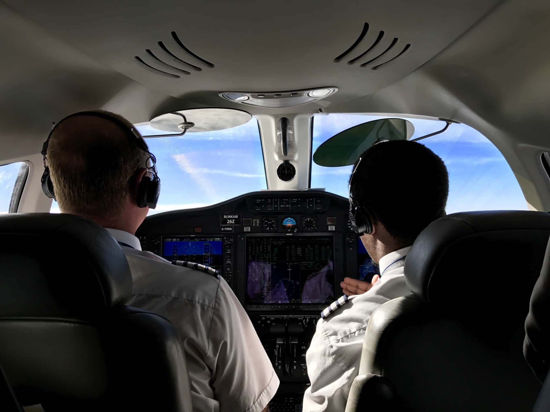 Two highly skilled pilots sitting in the cockpit
