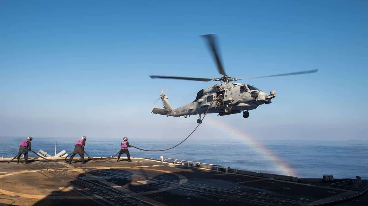 A helicopter flying over an ocean