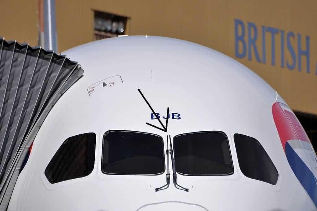 Windshield wipers located on the middle of a plane's windshield