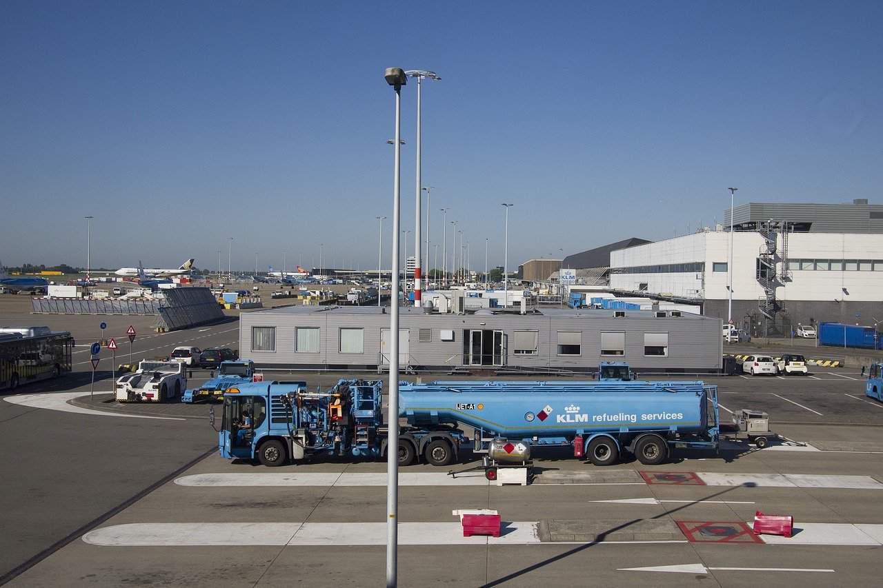 Planes just about to be refueled by a refueling truck