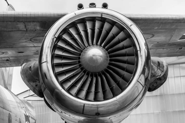 A plane's jet engine in black and white