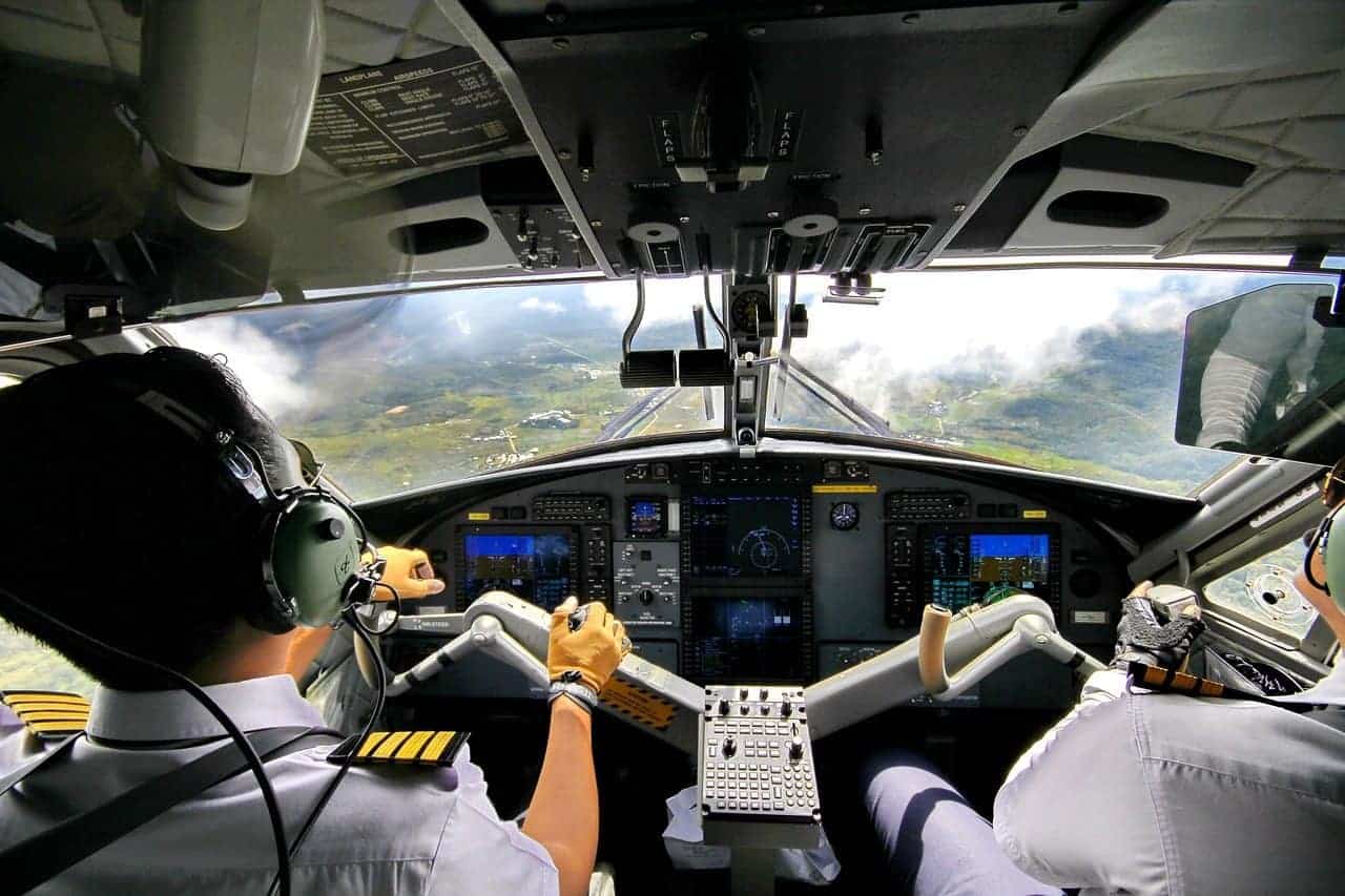 Pilots in the cockpit getting ready to land