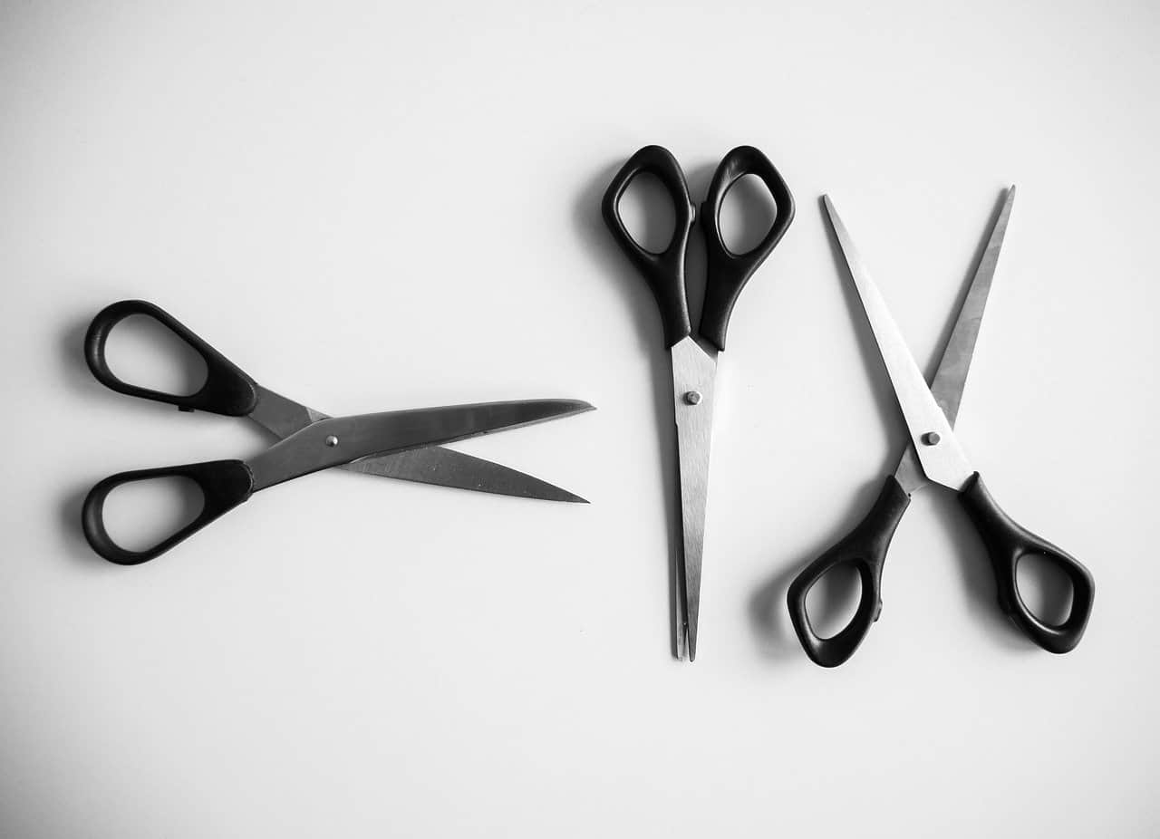 3 pairs of opened and unopened scissors on a table