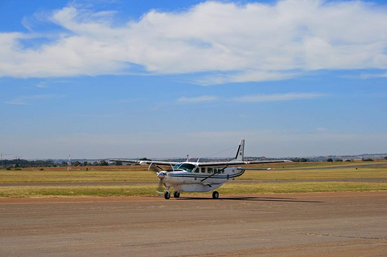 A small plane just about to take off on a runway