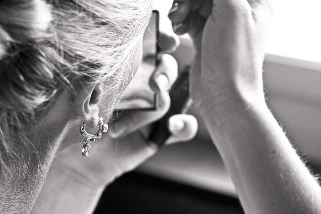 A closeup of a flight attendant with a piercing