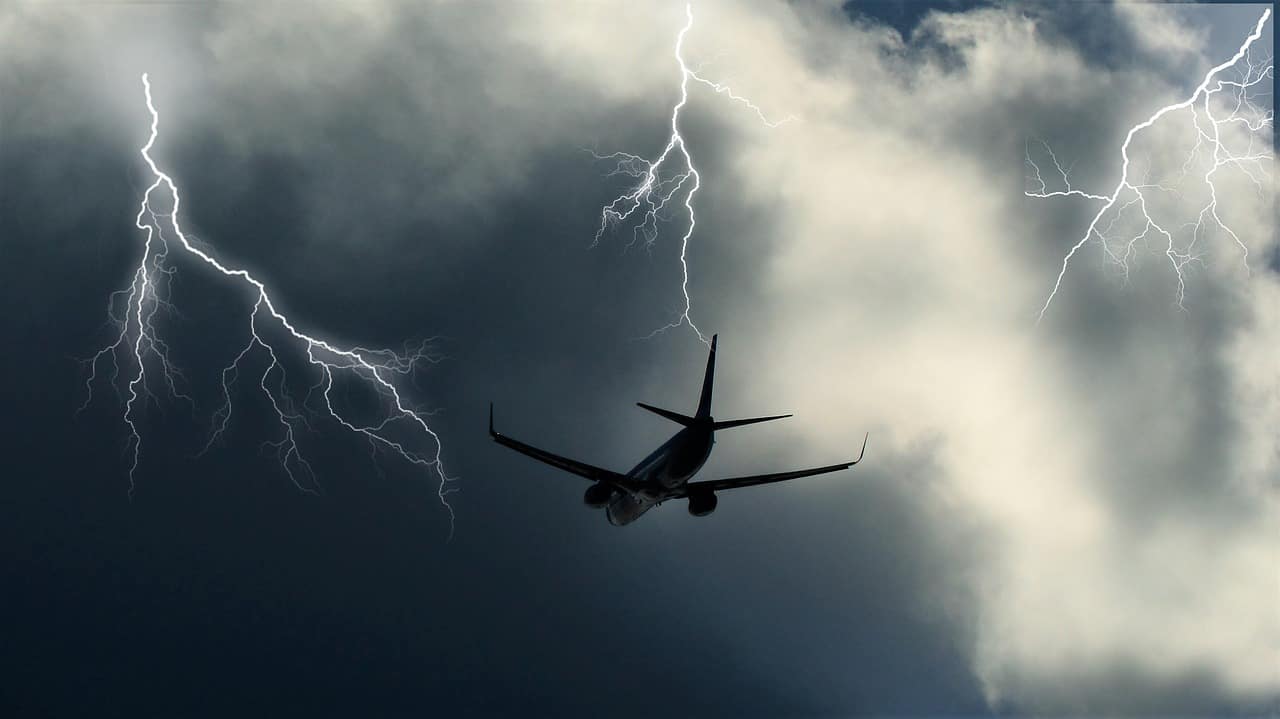 A plane flying in turbulence and lightning