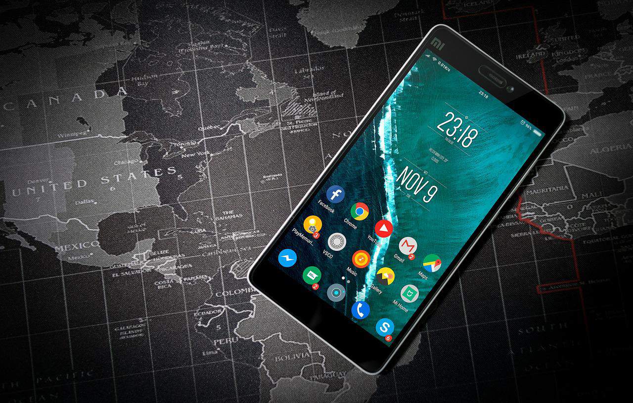 A phone resting on a world map