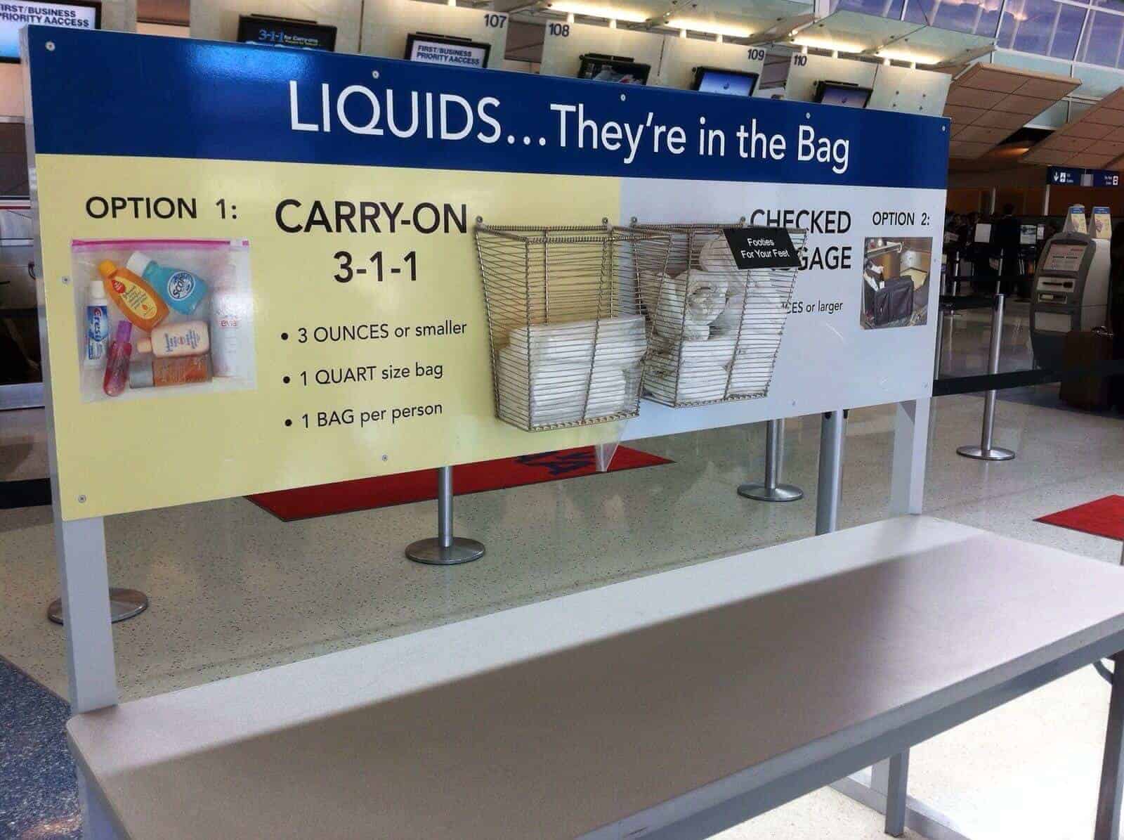 A 3-1-1 liquids rule sign at an airport