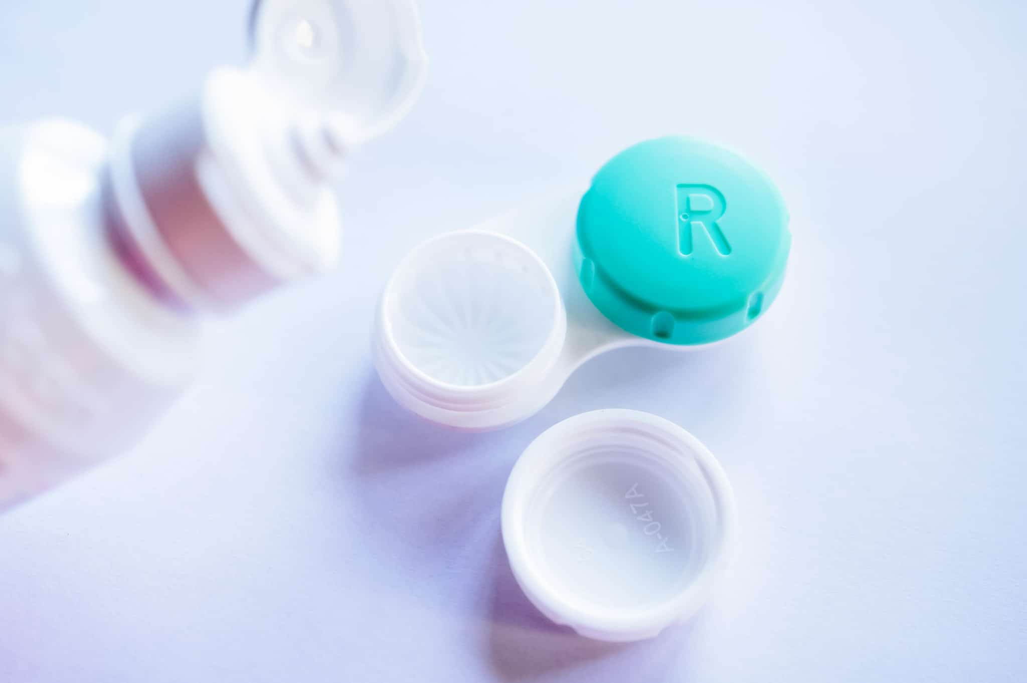 Contact lens solution and an opened contact lens container