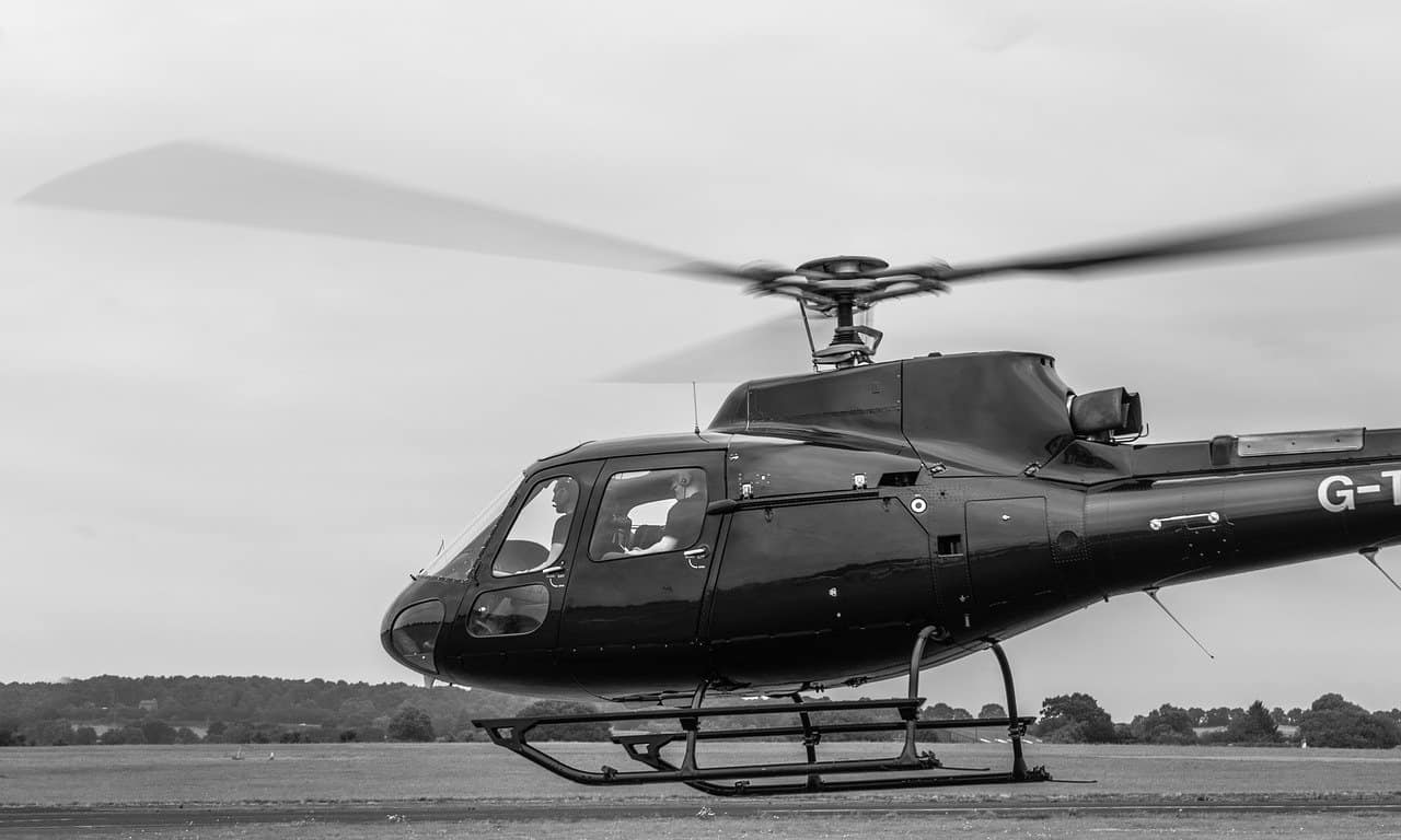 A helicopter spinning its blades loudly