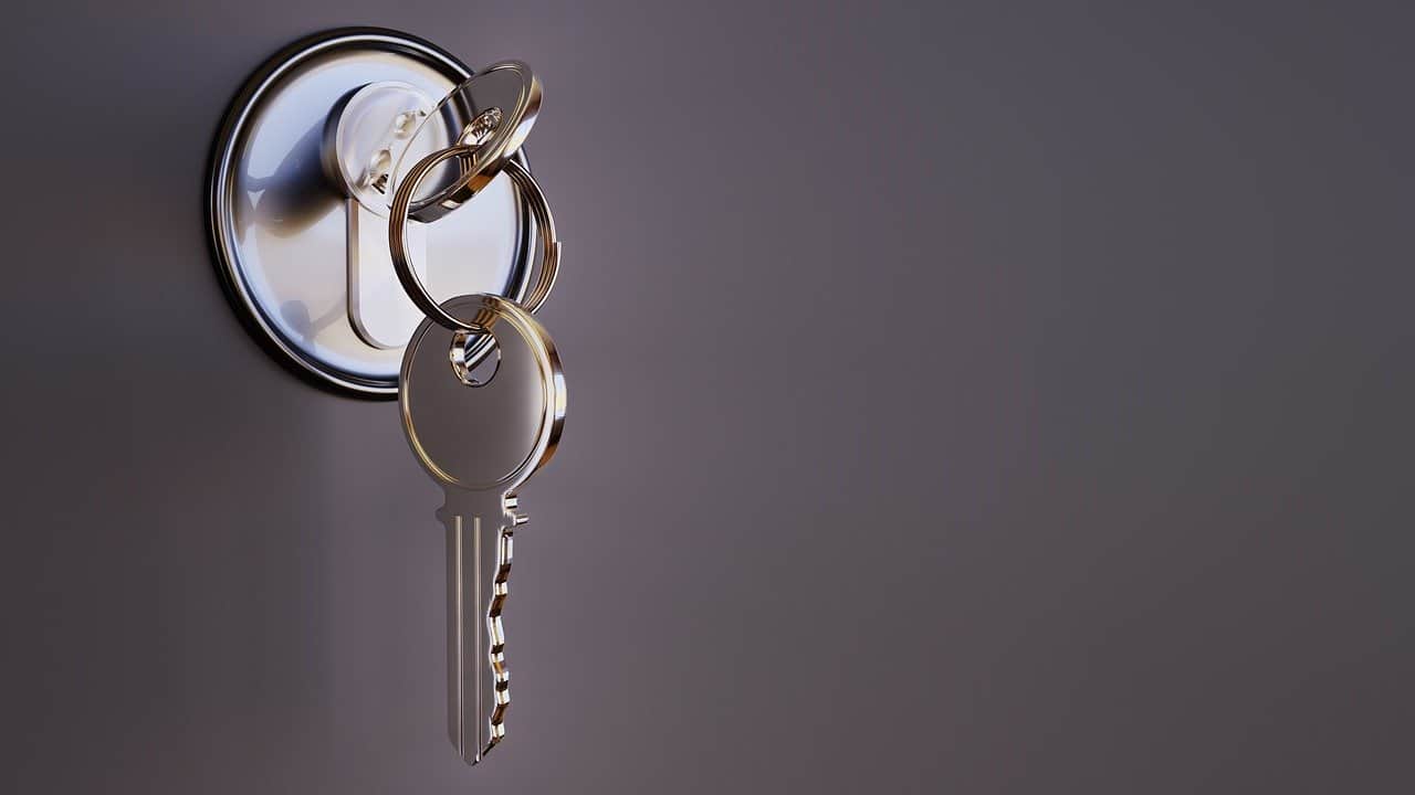 Keys inserted inside the lock of a door