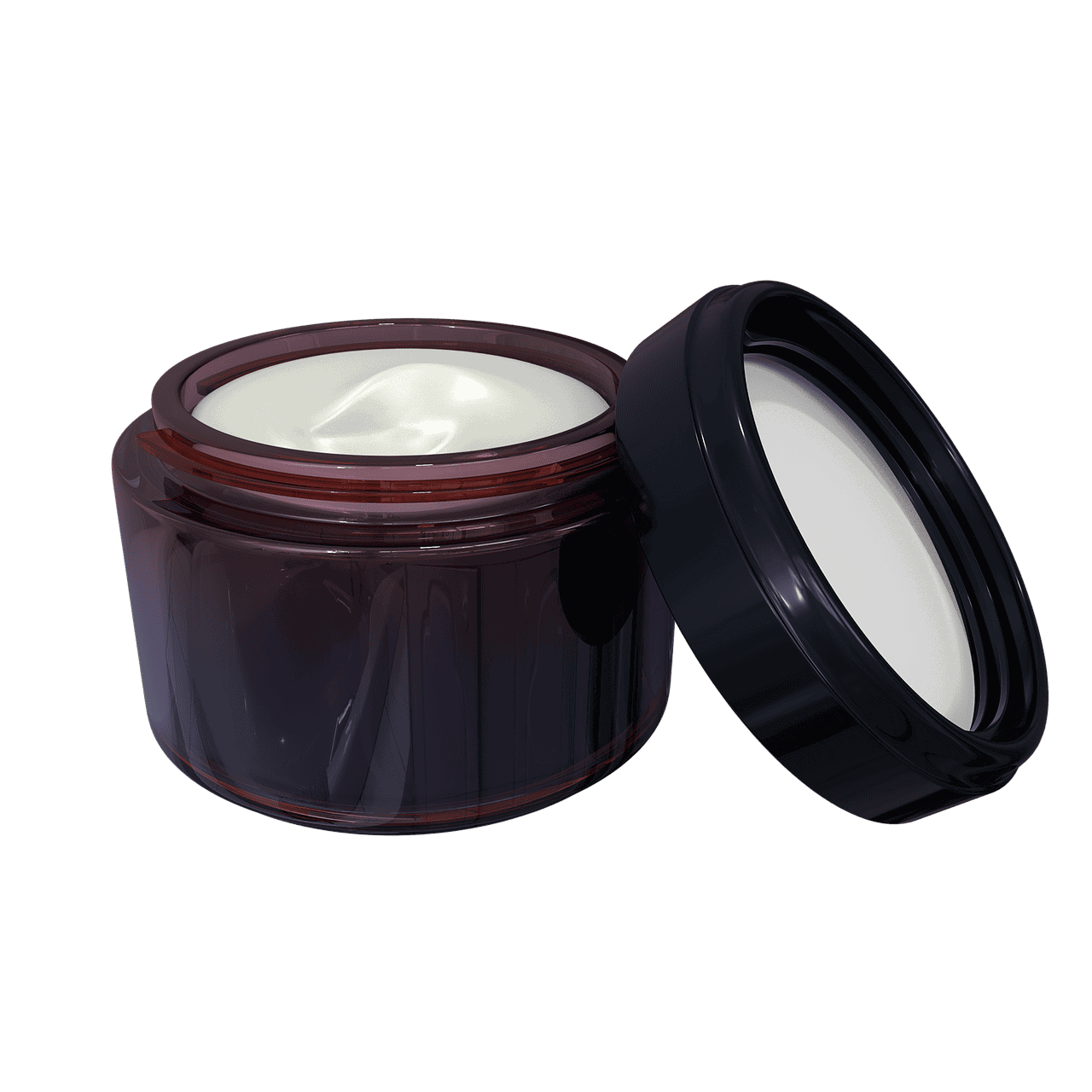 An open jar of lotion with its lid resting against it