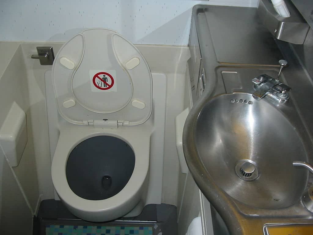 An airplane toilet and sink