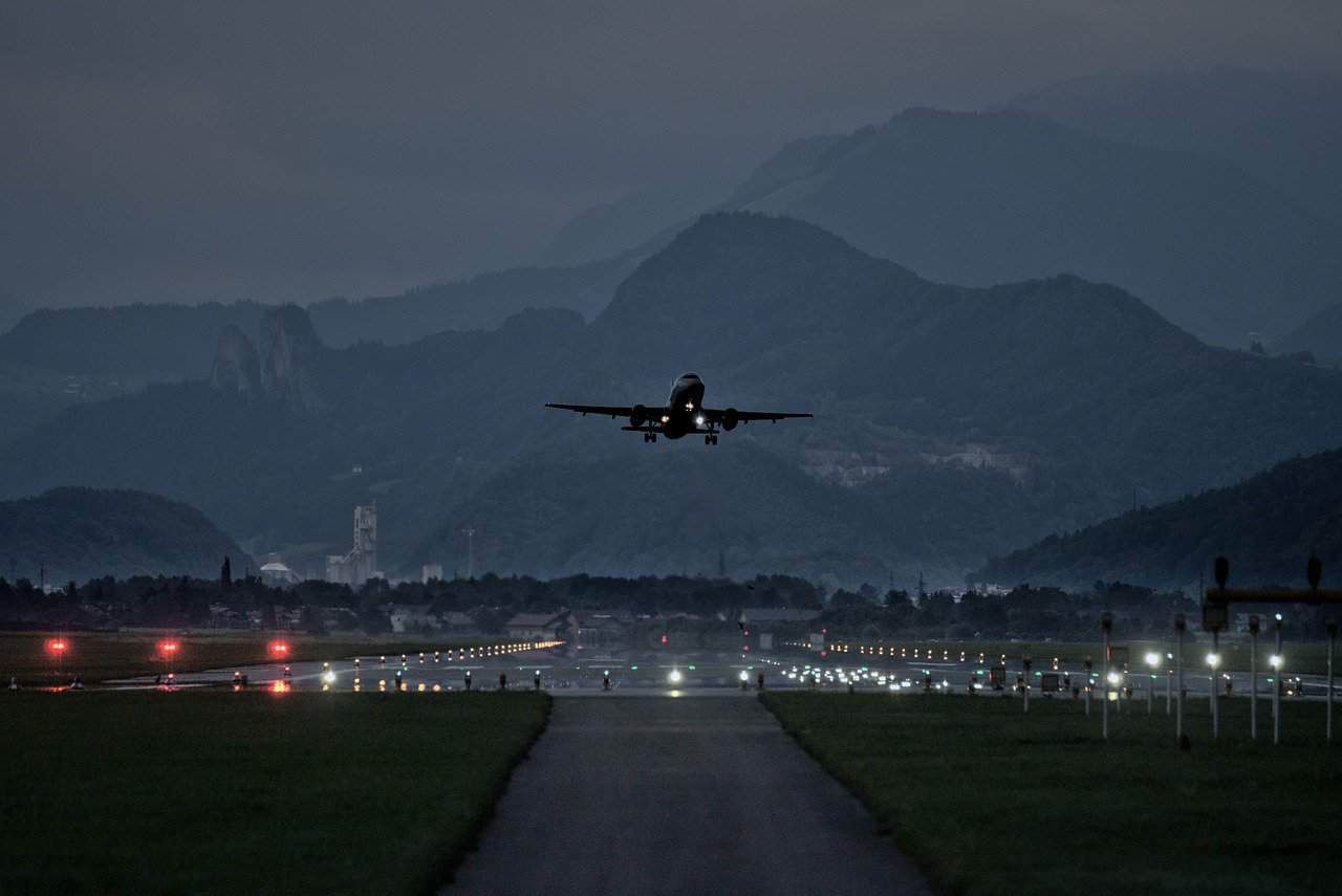 A red eye flight plane approaching to land