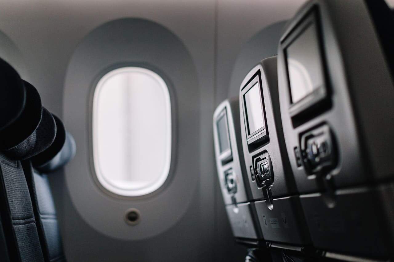 An airplane window in a Boeing plane
